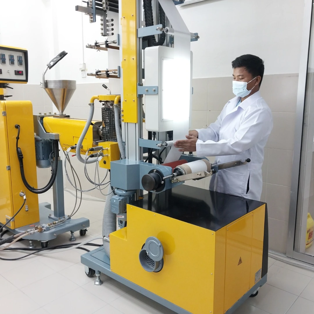 Earthya lab technician operating production machinery in Ipoh